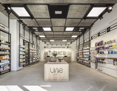 » UNE Farmacia Wall Detailing, Retail Interior Design, Pharmacy Design, Exposed Concrete, Retail Design Blog, Retail Interior, Shelving Systems, Taking Over The World, Historical Architecture