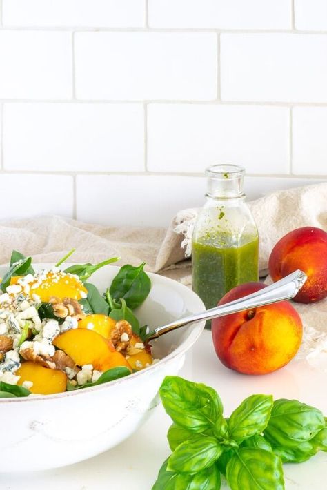 This Spinach Salad with Nectarines   Basil Dressing is quintessentially summer. The tang of the nectarines plays perfectly with basil’s herby, subtle peppery, and minty taste. The salad is topped with crunchy, toasted walnuts and a sprinkle of earthy gorgonzola.Sometimes my best recipes are a result of happenstance. I had a bunch of just ripe nectarines and a bounty of fresh basil that I needed to use. In the tastebuds of my mind, those two flavors really needed to go together, and a f… Salad With Nectarines, Salad With Basil Dressing, Nectarine Salad, Wine Pairing Dinner, Sliders Recipes Chicken, Basil Vinaigrette, Rainbow Salad, Mozzarella Salad, Pasta Salad Italian