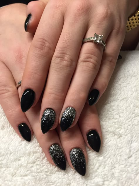 Black with glitter ✨ Black Nails With Glitter Almond, Black Nails Glitter Accent, Black And Silver Almond Nails Designs, Black Nails Glitter Tips, Black Glitter Nails Coffin, Black Glitter Halloween Nails, Black Sparkle Nail Designs, Holiday Nails Black, Black Bridal Nails