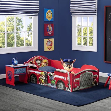 Functional with built-in study areas and multiple shelves for ample storage. Perfect for kids' rooms, dorms, and small spaces. Dimensions are 54.53"L x 29.92"W x 18.90"H with a maximum weight recommendation of 200 pounds. Includes safety features like 2 high side rails to ensure a secure transition to a big kid bed. Easy to assemble and JPMA certified. #DeltaChildren #ToddlerBed #PawPatrol #KidsFurniture #SafeSleeping #Sponsored Paw Patrol Room Decor, Wood Toddler Bed, Paw Patrol Room, Paw Patrol Bedroom, Toddler Bed Boy, Colorful Fire, Kid Bed, Truck Graphics, Boy Toddler Bedroom