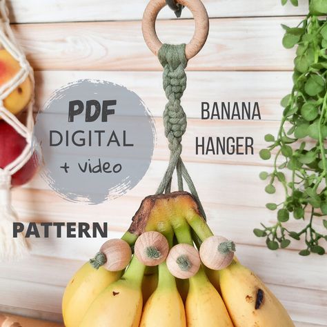 "PDF TUTORIAL for macrame banana hanger.  DIGITAL FILES with PICTURES, written INSTRUCTIONS in ENGLISH and link to video. This Macrame Banana Hanger PDF pattern is a comprehensive guide to creating a stylish and functional hanger for your bananas. With detailed instructions, accompanied by clear photos and a helpful video link, you'll be able to craft your very own banana hanger. For this project you will need 3mm twisted cotton cord, a wooden ring, and four wooden beads. The hanger's total leng Diy Banana Hanger, Macrame Banana Hanger Diy, Macrame Banana Hanger, Functional Macrame, Macrame Beginner, Macrame Instructions, Banana Hanger, Banana Holder, Kitchen Crochet