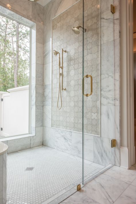 This Master Bathroom shower features beautiful, timeless marble, gold accents, and an incredible feature wall! Marble Tile Walk In Shower Ideas, Luxury Showers Master Baths, Gold Shower Fixtures, Marble Tile Shower, Master Shower Tile, Marble Shower Tile, Tile Walk In Shower, New Bathroom Ideas, Dream Farm