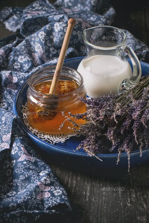 Honey, milk and lavender by NatashaBreen. Open glass jar of liquid honey with honeycomb and honey dipper inside, glass jug of milk and bunch of dry lavender in... #AD #Open, #glass, #jar, #NatashaBreen Glace Fruit, Honey Milk, Honey Photography, Brown Spots Removal, Honey Dipper, Organic Honey, Proper Nutrition, Milk And Honey, Healthy Nutrition