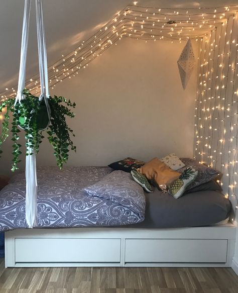 I put up these fairy lights in my bedroom with push pins ✨✨✨ Small spaces / attic room / plants / fairy lights / bedroom Slopped Roof Bedroom Ideas, Fairy Lights Bedroom Slanted Ceiling, Attic Room Ideas Aesthetic, Fairy Lights On Roof Bedroom, Leaves On Roof Bedroom, Attic Chill Room, Loft Bedroom Ideas Sloped Ceiling Aesthetic, Room Ideas Aesthetic Triangle Roof, Attic Room Aesthetic