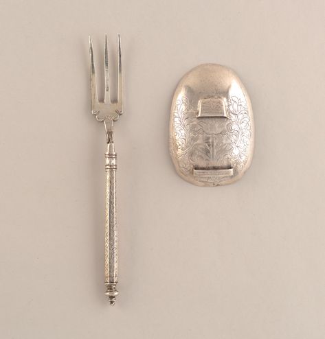 Fork has three curved tines, shoulders scrolled. Hinged at neck, faceted sliding lock bar. Octagonal handle with engraved fishbone decoration, baluster-shaped top. Large oval spoon bowl with three rings on the back to hold the tines of the fork. Simple engraved decoration on the bowl of the spoon. Fork And Spoon, Slide Lock, Three Rings, Forks And Spoons, Fish Bone, Design Museum, Finials, Shoe Box, Spoons