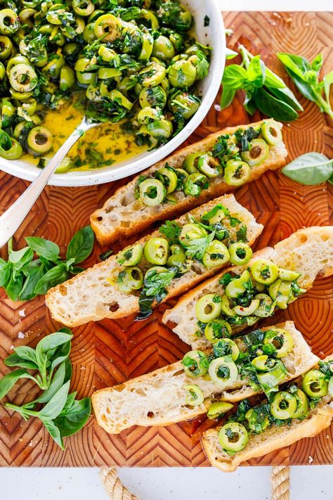 This green olive tapenade is made with buttery Castelvetrano olives, loads of fresh herbs, lemon zest, garlic, and Aleppo chili flakes bathed in extra virgin olive oil. Your focaccia bread will thank you. Castelvetrano Olives Recipe, Best Focaccia Bread, Best Focaccia, Green Olive Tapenade, Castelvetrano Olives, Focaccia Bread Recipe, Olive Recipes, Olive Tapenade, Vegetarian Side Dishes