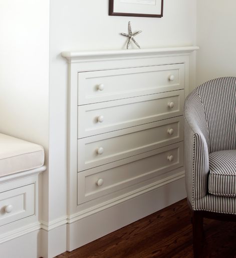 Built-in clothing storage is a no brainer, because it saves valuable floor space in your bedroom. This clever organizer has just as much room as a standalone piece, but leaves space for a pretty striped chair, too. Click for more genius home organizing ideas. Storage Hacks Bedroom, Built In Dresser, Furniture Gallery, Dresser Storage, Attic Storage, Attic Renovation, Upstairs Bedroom, Attic Bedroom, Attic Rooms