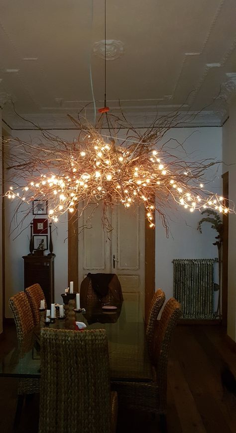 Tree branch chandelier with fairy lights Stick Chandelier Tree Branches, Tree Branch Chandelier Diy, Branch Lighting Chandelier, Diy Tree Chandelier, Tree Branch Lighting Diy, Branch Fairy Lights, Tree Branch Hanging Decor, Diy Branch Chandelier, Branch Lights Decor