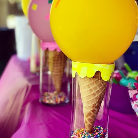 🍦How fun are these Ice Cream Cone centerpieces?!? Made with a glass vase, real waffle cones, balloons, sprinkle sticker squares then adding “dripping” ice cream paper shapes in matching colors, and voila! Your DIY summertime party centerpieces are complete! 💜💜💜 #icecreamparty #diypartydecor #partydecorinspo #summertimeparty #paperpartydesignink #icecreamdecor #icecreamcone #diybirthday #homemadebirthday #icecreambirthday #icecreamcenterpieces Sweets Party Centerpieces, Ice Cream Party Center Piece, I’ve Cream Party Centerpieces, Sweet One Party Centerpieces, Sweets Themed Birthday Party Centerpieces, Two Sweet Party Centerpieces, 3 Scoops Of Fun Birthday Decorations, Ice Cream Birthday Party Centerpieces, Two Sweet Party 2nd Birthday Centerpieces