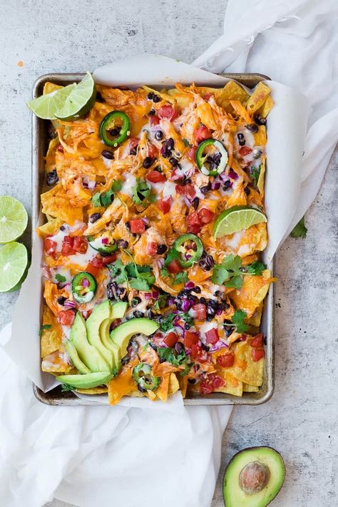 Buffalo Chicken Nachos | If you're on the hunt for a flavorful nacho recipe, these buffalo chicken nachos are the perfect amount of spice, piled hight with chicken, cheese and all of your favorite nacho toppings! || Oh So Delicioso Buffalo Nachos, Nachos Salad, Nachos Dinner, Buffalo Chicken Nachos Recipe, Nacho Appetizer, Nacho Salad, Easy Tailgate Food, Nacho Recipes, Nachos Cheese Recipe