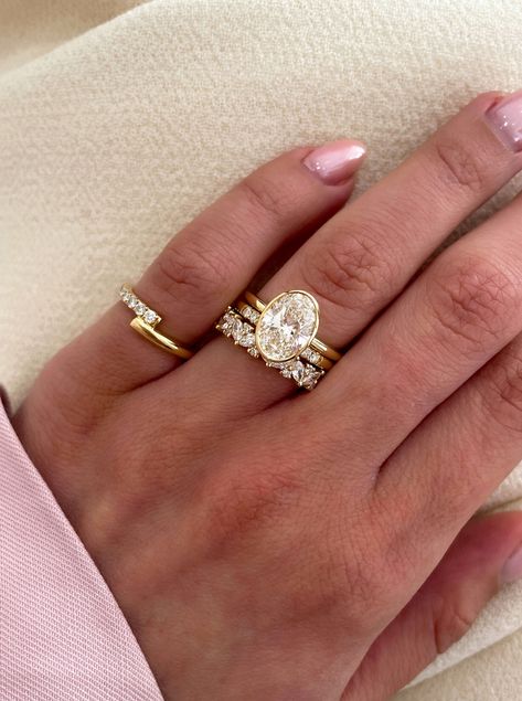 The ring stack inspo you didn't know you needed🤩  This is the perfect example of how you can mix and match stone shapes in your ring stack! ✨️  The Lana wedding ring features marquise and round-cut stones, the Peggy wedding ring features round stones, and the Sage engagement ring features an Oval.  We're literally obsessed💍 Oval Solitaire Wedding Stack, Triple Stack Wedding Ring, Oval Bezel Engagement Ring Stack, Three Stone Engagement Ring Stack, Round Ring Stack, Wedding Ring Stack Oval, Oval Wedding Stack, Bezel Engagement Ring Stack, Oval Wedding Ring Stack