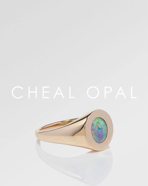 Our exquisite 0.61ct Green Opal Signet Ring is a masterpiece of sleek, modern design. The ring features a flawless 14k yellow gold band, its opal elegantly set in a flat circular bezel, seamlessly integrating with the band to create a smooth and harmonious look. The ring’s minimalistic design accentuates the gemstone’s vibrant colours, allowing its natural beauty to radiate. #chealopal Green Opal, Minimalistic Design, Vibrant Colours, Gold Band, Opal Rings, Signet Ring, Gold Bands, Minimalist Design, Natural Beauty