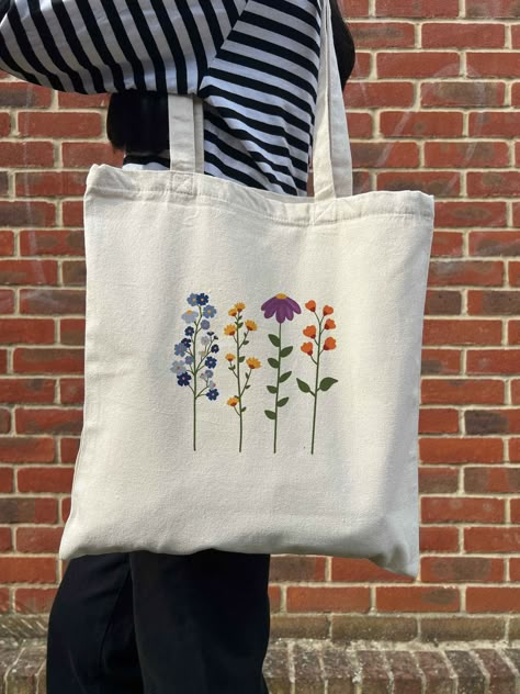 Cute Vibrant Wildflower Aesthetic Design on Canvas Tote Bag - Cosy Enjoyable Flower Vibes - Girlfriend Presents for Her - Y2K Type - Sublimation- #aesthetic #Bag #canvas #Colourful #cosy #Cute #Design #Flower #Fun #Gifts #Girlfriend #style #Sublimation #Tote #Vibes #Wildflower #y2k Check more at https://howcandothis.com/diyideas/cute-vibrant-wildflower-aesthetic-design-on-canvas-tote-bag-cosy-enjoyable-flower-vibes-girlfriend-presents-for-her-y2k-type-sublimation/ Tote Bag Ideas Paint, Sublimation Aesthetic, Totebag Aesthetic Design, Tote Bag Design Aesthetic, Ecobag Design Ideas, Aesthetic Tote Bag Design, Tote Bags Aesthetic, Girlfriend Presents, Wildflower Aesthetic