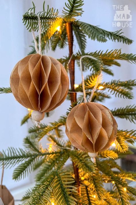 Make beautiful honeycomb Christmas ornaments using coffee filters! A fun, easy, and budget-friendly DIY project that adds festive charm to your holiday decor.#CoffeeFilterOrnaments #DIYHolidayDecor #ChristmasCraftsForKids #HoneycombCrafts #FestiveDIY #ChristmasDecorations Coffee Filter Balls, Coffee Filter Ornaments Holidays, Coffee Filter Decorations, Diy Bee Ornament, How To Make Honeycomb Decorations, Coffee Filter Christmas Ornaments, Cone Coffee Filter Crafts, Paper Honeycomb Decorations, Honeycomb Christmas Decorations