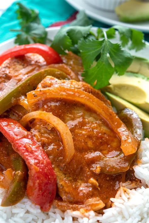 Look no further than these CHULETAS GUISADAS for a quick and easy pork chop dinner recipe! Simmered until tender with peppers, onions and sofrito for tons of flavor. A favorite Puerto Rican dish! Spanish Boneless Pork Chops, Puerto Rican Boneless Pork Chops, Fast Puerto Rican Recipes, Chuletas Puerto Rican, Pork Chop Recipes Puerto Rican, Pork Puerto Rican Recipes, Milanesa Dinner Ideas, Mexican Recipes With Pork Chops, Spanish Easy Recipes