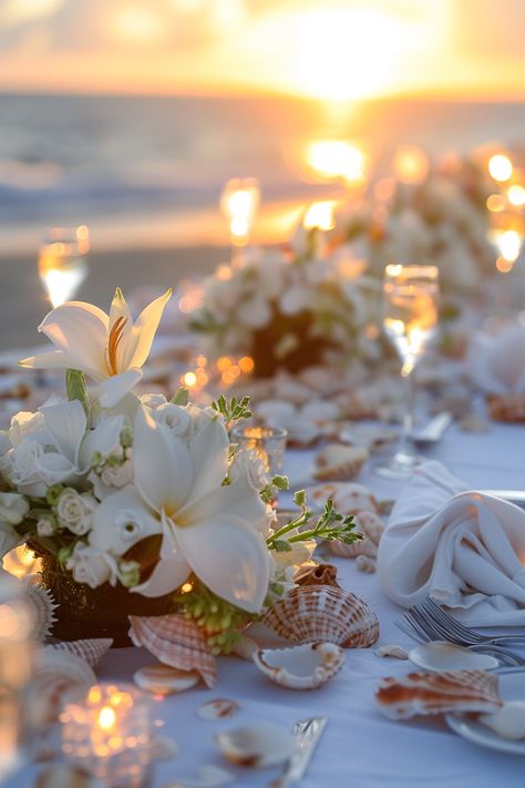 Beach wedding reception. Sunset background with white flowers and seashells-embellished dining tables.

Stunning ocean vistas, breezy cliffside beauty, the nautical charm of seashore treasures; coastal weddings have a magical allure of their own. If you're planning on saying 'I do' amidst the intoxicating salt-kissed air, then these 25 coastal wedding reception décor ideas are definitely a wave worth riding. From mesmerizing marine-inspired…

Read more: https://tastywed.com/25-coastal-wedding-reception-decor/ Coastal Wedding Reception, Beachy Centerpieces, Seashell Wedding Decor, Coastal Wedding Theme, Coastal Wedding Centerpieces, Sea Shell Wedding Decor, Coastal Wedding Ideas, Coastal Weddings, Seashell Wedding