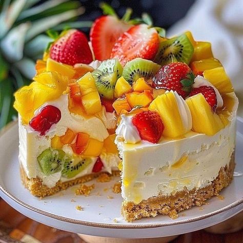 Tropical Fruit Salad Cheesecake 🥭🍍  📋 Ingredients: - 2 cups graham cracker crumbs - 1/2 cup unsalted butter, melted - 3 (8 oz) packages cream cheese, softened - 1 cup granulated sugar - 1 teaspoon vanilla extract - 3 large eggs - 1 cup sour cream - 1/2 cup heavy cream - 1 cup diced mango - 1 cup diced pineapple - 1 cup diced kiwi - 1 cup sliced strawberries - 1/4 cup mango or pineapple jam  👩‍🍳 Directions: 1. Preheat the oven to 350°F. 2. Mix graham cracker crumbs with melted butter and press into the bottom of a 9-inch springform pan. Bake for 10 minutes and let cool. 3. In a large bowl, beat cream cheese with sugar and vanilla until smooth. Add eggs one at a time, beating well after each addition. Stir in sour cream and heavy cream. 4. Gently fold in diced mango, pineapple, kiwi, an Fruit Salad Cheesecake, Cheesecake Ingredients, Fruit Cheesecake, Tropical Fruit Salad, Pineapple Jam, Sliced Strawberries, Fancy Desserts, Graham Cracker, Tropical Fruit