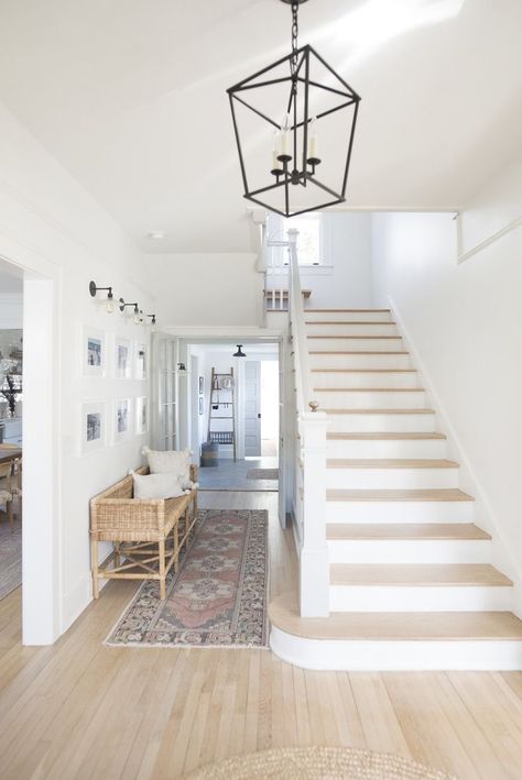 Pure White Walls, Rattan Bench, Light Oak Floors, Front Entryway, White Oak Floors, Wood Stairs, Circa Lighting, High Ceilings, Staircase Design