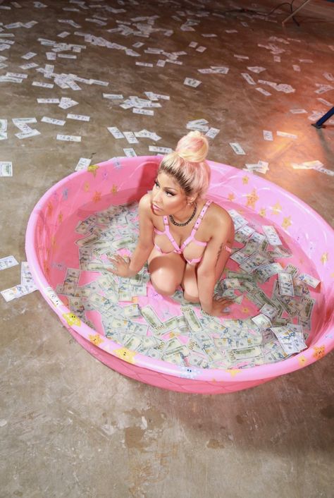 this is a funny photo of Nicki Minaj sitting in a pink kiddie pool full of money and water.:). Nicki Baby, Nicki Minaj Wallpaper, Cozy Sitting Area, Nicki Minaj Barbie, Nikki Minaj, Nicki Minaj Photos, Nicki Minaj Pictures, Kiddie Pool, Pink Friday