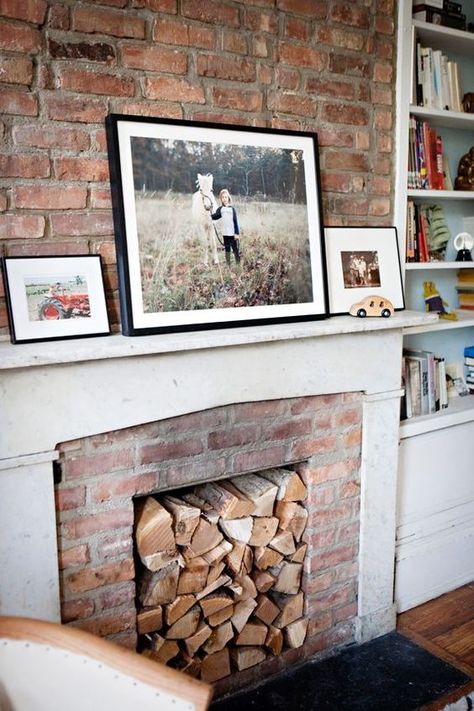 92 Non-Working Fireplace Decor Ideas - DigsDigs Fireplace Reading, Interior Alchemy, Exposed Brick Fireplaces, Diy Fireplace Mantle, White Wash Brick Fireplace, Fireplace Modern Design, Unused Fireplace, Cup Of Jo, The Mantle