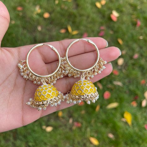 Liven up your outfit with our lovely Yellow Mishti jhumka Bali earrings. These gold-plated jhumkas have hand-painted meenakari with dangling pearls. Specifications Materials used: meenakari, pearls, gold plating Length: 6 cm Weight: 35 grams At Romikas, we pride ourselves on the craftsmanship and high quality of our jewelry, designed to enhance your natural beauty. Please contact us with any questions. Yellow Meenakari Earrings For Diwali, Yellow Meenakari Earrings For Festive Season, Yellow Meenakari Chandbali Earrings, Yellow Meenakari Chandbali Danglers, Yellow Meenakari Jhumkas For Wedding, Festive Yellow Meenakari Earrings, Yellow Chandbalis For Festivals Gift, Yellow Meenakari Chandbalis For Festive Occasions, Festive Yellow Meenakari Danglers