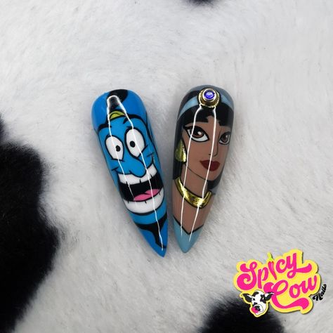 Two handpainted stiletto nail tips, one has Genie on and the other has Jasmine, both photographed against a cow print background Genie Nails, Aladdin Nails, Jasmine Nails, Disney Aladdin Genie, Princess Nails, Aladdin Genie, Genie Aladdin, Nail Style, Disney Aladdin