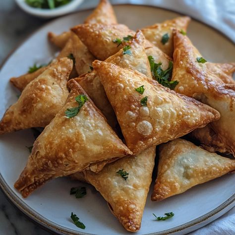 Samosas are believed to have originated in the Middle East as far back as the 10th century, known as "Sambusak." They traveled to India through Central Asia and were quickly adopted into Indian cuisine, especially for street food. Over time, regional variations developed, with fillings like spiced potatoes, lentils, and meat becoming common. 

#VegetarianSamosa #IndianFood #SamosaLovers #StreetFood #EasyRecipes #CrispySnacks #HomeCooking #PlantBasedEats India Food, Samosa, Lentils, Home Cooking, Street Food, Indian Food Recipes, Easy Meals, Snacks, 10 Things