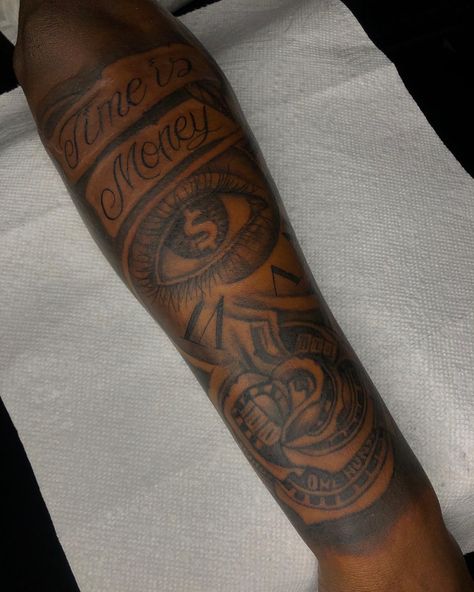 Black Male Tattoos Arm, Boy Tattoos Black Boys, Money Tattoo Ideas For Men, Black Men Tattoos Ideas Forearm, Outside Forearm Tattoo Men Sleeve, Road To Riches Tattoo, Unique Half Sleeve Tattoos Men, Back Forearm Tattoo Men, Black Male Tattoos