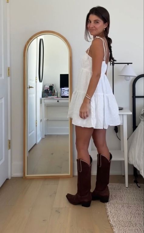 Cowgirl White Dress Outfit, White Flowy Dress With Cowgirl Boots, White Dress With Brown Boots, White Mini Dress With Cowboy Boots, Dresses With Brown Cowboy Boots, Sundress And Cowgirl Boots, Coastal Cowgirl White Dress, Summer Dress Cowboy Boots, White Dress Country Concert