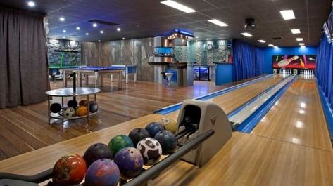 Home cinemas and tennis courts seem commonplace compared to having a bowling alley in your home. Mansion Arcade Room Luxury, Bowling Alley Interior Design, Home Bowling Alley, Contemporary Mansion, Mansion Rooms, Tiered Seating, Arcade Room, 1st House, Dream Ideas