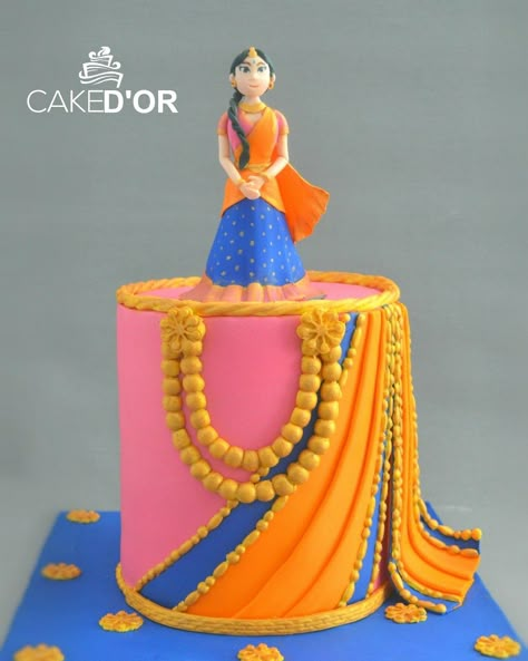 A traditional Indian Saree theme cake!   #punecakes #punebaker #halfsareecake #sareecake #cakedor Half Saree Cake Designs, Half Saree Function Cake, Saree Cake Design, Saree Theme Cake, Bollywood Theme Cake, Saree Cake, Bollywood Cake, Sarees Function, Puberty Function