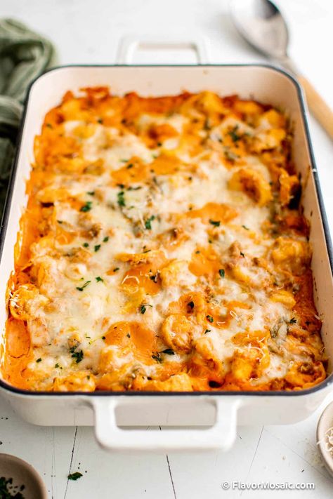 Hot cheesy tortellini bake features Italian sausage, pillowy tortellini and fresh garlic to tie all of the flavors together. It’s the ultimate comfort food after a long day and you can save the leftovers for lunches throughout the week. Cheesy Tortellini Bake, Baked Tortellini Recipes, Italian Sausage Casserole, Cheesy Casserole Recipes, Cheesy Tortellini, Tortellini Bake, Sausage Tortellini, Tortellini Recipes, Tortellini Pasta