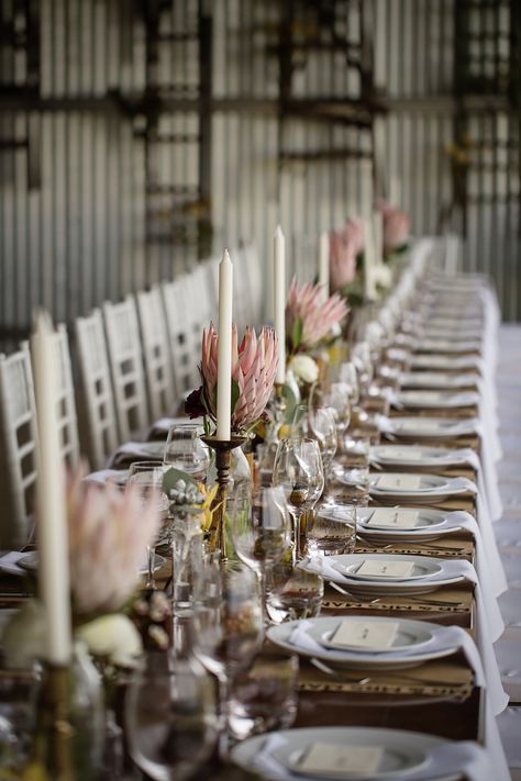 Protea Table Setting, Country Wedding Place Settings, Protea Wedding Table Decor South Africa, Protea Table Decor, Protea Wedding Decor, Protea Wedding Table Decor, Shed Wedding Reception, Protea Flower Wedding, Proteas Wedding