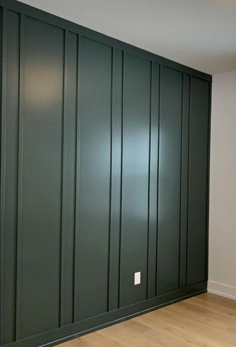 Wall With Trim In Middle, Dark Green Batten Board, Vertical Feature Wall, Green Accent Wall Board And Batten, Emerald Board And Batten Wall, Fluted Wainscoting, Dark Green Wall Panelling, Green Waynes Coating, Vertical Moulding Accent Wall