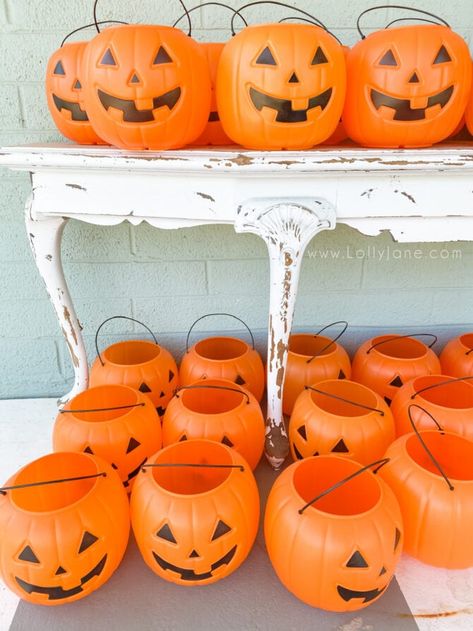 Plastic Pumpkin Outdoor Decor, Diy Halloween Decorations With Pumpkin Buckets, Hanging Pumpkin Decor, Hanging Fall Decorations Outdoor, Diy Hanging Pumpkin Lanterns, Light Up Halloween Buckets Diy, Pumpkin Trick Or Treat Bucket Decor, Jack O Lantern Topiary, Pumpkin Hanging Basket