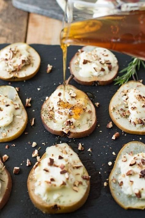 Baked pears are filled with creamy, tangy Chevrot French goat cheese, topped with sweet honey, sprigs of fresh rosemary and pecans for an easy snack or elegant appetizer. Food Dinners, Baked Pears, Elegant Appetizers, Think Food, Snacks Für Party, Rigatoni, Goat Cheese, Clean Eating Snacks, Easy Snacks