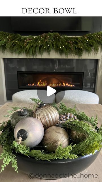 Donna Delaine Dyck / Home decor & design on Instagram: "My new favourite ornaments ✨ In a holiday decor bowl…a simple and beautiful statement! I think these ornaments are so gorgeous! The rustic glam collection from pottery barn has a vintagey look..with soft muted tones. Perfect for my neutral loving heart🤎 I love a pretty decor bowl ..for a coffee table, dining table, console..✨ Comment ‘shop’ for links! Details✨ Large bowl Cedar garland Fairy lights (the green wire ones are nearly invisible here) 2 large pinecones and 5 ornaments" What To Put In Bowls For Decoration, Christmas Dough Bowl Table Centerpieces, Bowl Of Ornaments Centerpieces, Holiday Bowl Decor, Bowl With Ornaments, Christmas Orbs Decorating Ideas, Bowl Of Ornaments, Christmas Centerpieces For Coffee Table, Simple Christmas Coffee Table Decor