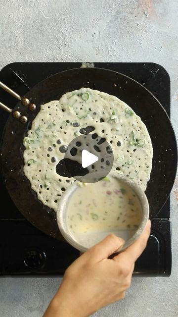 Sanjana Modha on Instagram: "Perfect Rava Dosa — Splash the batter on to a searing hot pan to create this beautiful lacy goodness.  💧This style of dosa is made with a flowing batter of semolina, yoghurt, herbs and spices. I like them HOT so use both green chilli and black pepper. You can adjust it according to your own preferences.  Unlike other traditional styles of South Indian dosa, these don’t require fermentation which means you can get them on the table quickly. A 30 minute rest is long enough for the semolina to hydrate and the batter to be ready.   📝 Full recipe is in the video — I used a couple of tablespoons of dairy free (soy) yoghurt but you can use any kind.  #southindian #ravadosa #mealprep #dinnerideas #pancakes" Rava Dosa Recipe, Indian Dosa, Dosa Batter Recipe, Ragi Dosa, Rava Dosa, Dosa Recipe, Traditional Styles, Green Chilli, Herbs And Spices