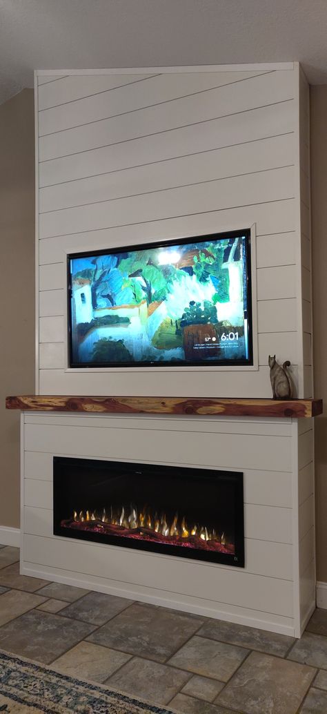 Electric fireplace, cedar mantel, recessed tv Recessed Tv, Diy Electric Fireplace, Electric Fireplace Living Room, Fireplace Feature Wall, Basement Fireplace, Built In Electric Fireplace, Electric Fireplace Wall, Build A Fireplace, Fireplace Tv Wall