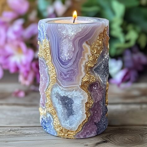 The Geode Candle is a stunning, nature-inspired piece that combines the beauty of crystals with the warmth of candlelight. Shaped like a real geode, the outer surface mimics the rugged texture of stone, while the inside reveals intricate, crystal-like formations that sparkle when illuminated. Hand-poured with premium, long-lasting wax, each candle boasts a unique, gemstone-like appearance, offering a blend of art and ambiance. As the candle burns, it casts a soft, radiant glow, creating a soo... Geode Candle Holder, Geode Candle, Luxurious Candles, Sparkling Candle, Geode Decor, Decor Market, Stunning Nature, Candle Glow, Unique Products Design