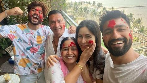 Katrina Kaif and Vicky Kaushal wished their fans on Holi 2022. They shared a happy family photo as they celebrated the festival of colours at home. On the occasion of Holi 2022, Katrina Kaif, Vicky Kaushal shared a photo from their celebration at home. The photo featured Vicky, Katrina, Vicky's mom, Sham Kaushal, and Sunny Kaushal. The couple celebrated their first Holi with the family and even went on to wish fans. They wished fans on the occasion of Holi and posed for some beautiful photos. Th Vicky Katrina, Sunny Kaushal, Happy Family Photos, Wedding Reveal, Holi Photo, Vicky Kaushal, Holi Celebration, Happy Photos, After Marriage