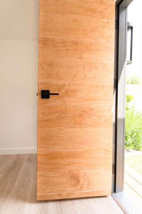 The Easy DIY Paneled Door You'll Want to Try - Neatly Living Build Your Own Front Door, Plank Door Makeover, Diy Wood Doors Interior, Diy Panel Door Makeover, Exterior Door Makeover Diy, Mid Century Bifold Doors, Diy Modern Front Door, Modern Wood Interior Doors, Modern Indoor Doors