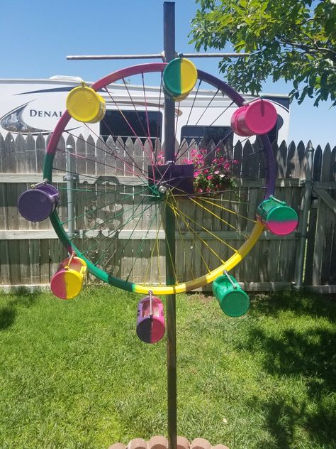 Ferris wheel bird feeder made out of old bicycle rim and PVC pipe. Garden Diy Furniture, Diy Photo Display, Bird Feeder Craft, Bicycle Rims, Old Bicycle, Outdoor Chandelier, Cardboard Sculpture, Wheel Art, Diy Bird Feeder