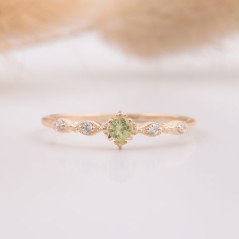 14k yellow gold antique victorian peridot minimalist engagement ring, Delicate & small peridot promise ring for her, Anniversary gift ring WE OFFER UNLIMITED PERIOD INSTALLMENTS PLAN This is a beautiful, stunning, feminine ring that works well for all occasions, styles, and ages. You will love it! Ring information: Main stone: Peridot Approximate size: 2.5mm (1 stone) Accent stones: White cubic zirconia Approximate size: 1.25mm (4 stones) Approximate width of Band 1.0mm Metal type: Gold Metal st Engagement Ring Peridot, Engagement Rings Peridot, Antique Engagement Rings Victorian, Engagement Ring Delicate, Cute Promise Rings, Peridot Engagement Rings, Dainty Engagement Rings, Promise Ring For Her, Cute Engagement Rings