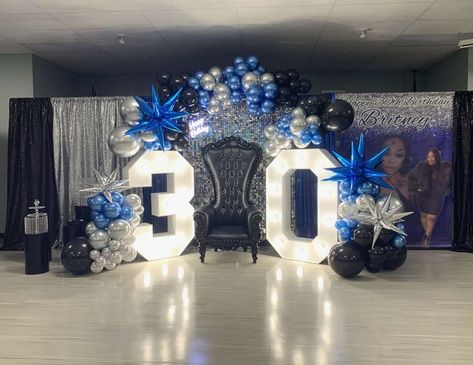 Britney’s black royal blue and silver surprise 30th birthday Blue Black White Party Decorations, Blue Gold Black Party, Royal Blue Prom Decorations, Royal Blue Black And Silver Party Decorations, Navy Blue And Black Birthday Party Decorations, Blue Silver Birthday Decorations, Silver And Blue Party Decor, Royal Blue Anniversary Theme, Fifty Shades Of Blue Party