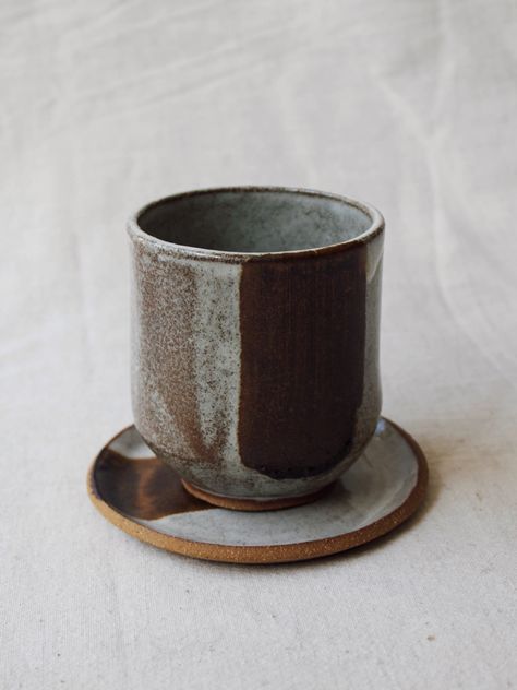 Handbuilt cup with a rounded bottom placed on a small plate being used as a saucer or coaster. Decorated in a white glaze with a red iron oxide stripe. Pottery Iron Oxide, Pottery Oxides, Iron Oxide Ceramics, Oxide Ceramics, Coil Ceramics, Handbuilding Techniques, Ceramic Handbuilding, Pottery Colors, Glaze Painting