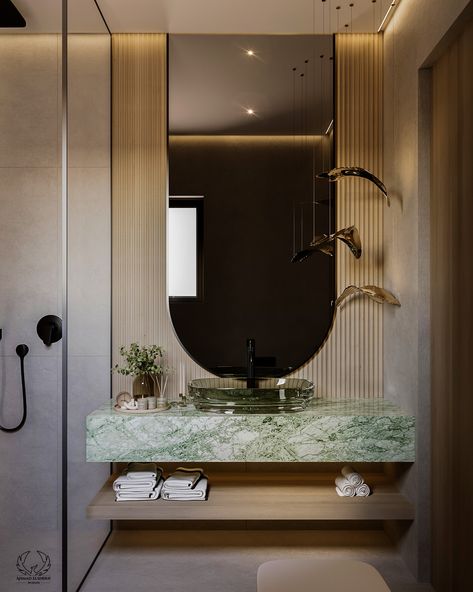 A gorgeous green marble sink table is combined with a sleek light green glass sink for a fresh look. Soft beige walls and eye-catching black fixtures will complete the luxurious look. This elegant mix results in an elegant and luxurious look.

#LuxuryBathroom #ModernElegance #GreenMarble #BlackFixtures #BathroomDesign #bathroomRedesign #homeDecor Elegant Toilet Design, Green And Beige Bathroom, Glass Sink Bathroom, Light Green Marble, Green Marble Bathroom, Marble Sink Bathroom, Sink Table, Marble Bathroom Sink, Luxury Modern Bathroom