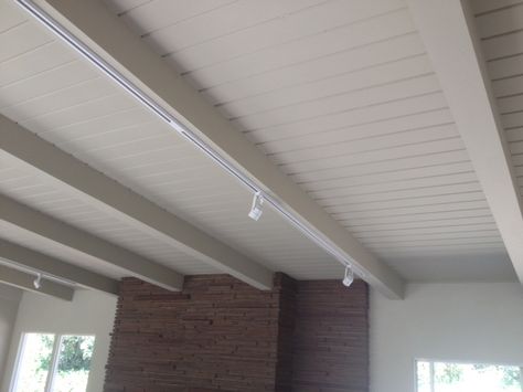 White beams, track lighting Track Lighting Office, White Beams Ceiling, Lighting Ideas Bedroom, Track Lighting Ideas, White Track Lighting, Attic Nook, Vaulted Ceiling Lighting, Lighting Office, Attic Playroom