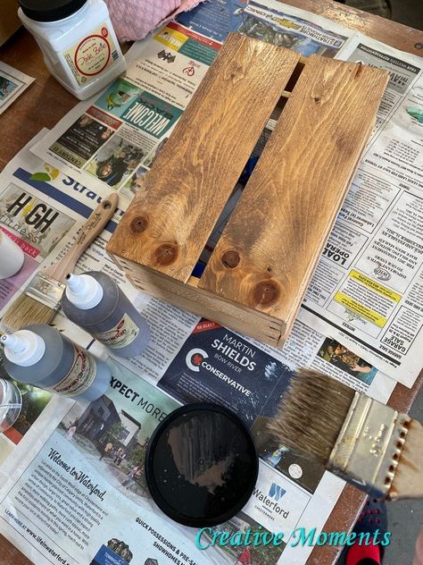 Spring is just around the corner so when I found this wooden tulip bulb crate I knew I could give it a fun update from the boring raw wood look. It was solidly made crate for Home Hardware. It just needed a good scrubbing and ready for its makeover. The first coat was to darken the wood. I used a  Dixie Belle chip brush and my  Fine Mist Spray Bottle to apply  Dixie Belle Voodoo Gel Stain in tobacco road. Misting the wood allows the pores to open and a… Dixie Belle No Pain Gel Stain, How To Strip Old Paint From Wood, White Chalk Paint With Dark Wax Finish, Gray Chalk Paint With Dark Wax Finish, Fine Mist Spray Bottle, Dry Brush Technique, Tulip Bulbs, Mist Spray, Dark Wax