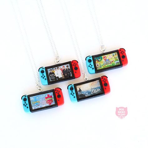 Nintendo Switch Console Necklace Handmade Polymer Clay Nintendo Super Mario, Zelda, BTS Band, Pokemon Switch Controller Kawaii Gamer Gameboy by ManekiIsland on Etsy https://www.etsy.com/listing/768708772/nintendo-switch-console-necklace Clay Nintendo, Pokemon Switch, Bts Band, Nintendo Switch Console, Nintendo Console, Weird Jewelry, Nintendo Switch Accessories, Quirky Earrings, Polymer Clay Christmas